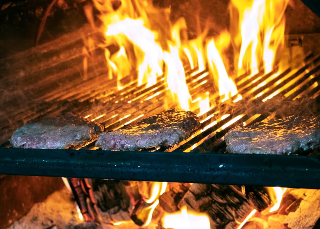 Meat set over the open flame to begin its sear